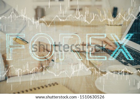 Multi exposure of stock market graph with man working on laptop on background. Concept of financial analysis.