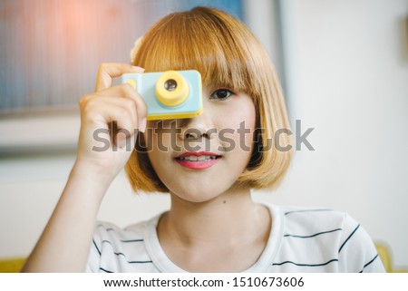 pretty young woman with camera.