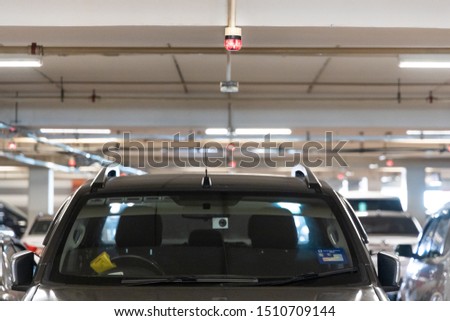 Smart car parking tracking system in mall with lights signals to track, indicated and navigate car to available vacancy