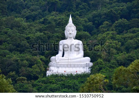 Big Buddha white color, at Wat Thep Phitak Punnaram temple in the mountain and forest, Korat, Thailand.Unseen  white buddha in forest.