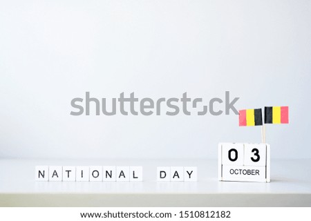 October 03 Wooden calendar and flag Germany Concept Germany national day.with space for your text.
