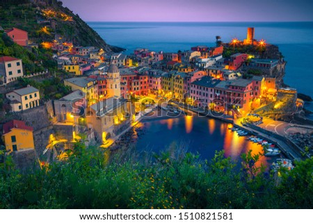 Picturesque touristic village on the hill with colorful buildings. Well known travel and photography place at sunset with street lights, Vernazza, Cinque Terre National Park, Liguria, Italy, Europe