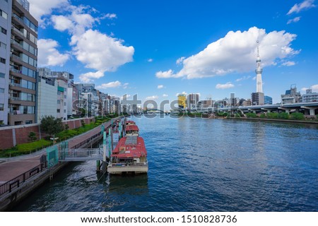 SCENERY WITH HOUSEBOATS FLOATING ON THE SUMIDA RIVER IN TOKYO