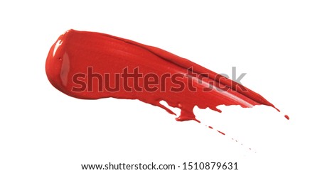Lipstick smear smudge swatch isolated on white background. Make up cream texture. Bright red color cosmetic product brushstroke swipe sample