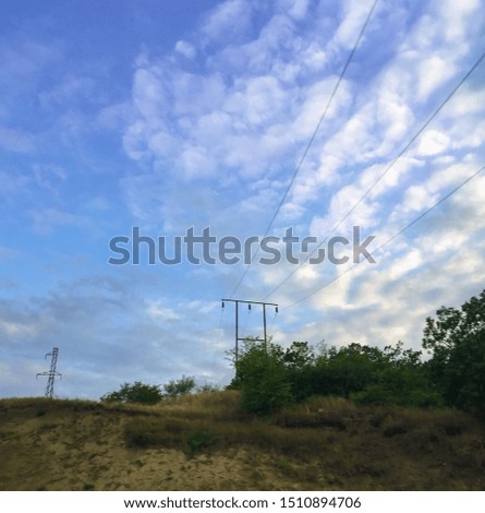 Caucasus mountain against the blue sky. Dagestan. Trees, rocks, mountains. mountain landscape and electric pole