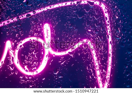glass with drops and neon lines