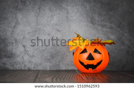 halloween background decorated holidays festive concept / jack o lantern pumpkin halloween decorations with leaves autumn on dark background for party accessories object