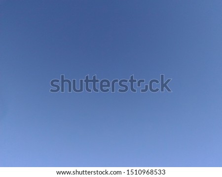The sky is bright and blue during the sunny day. Very acceptable for image background.