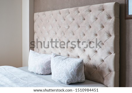 double bed with soft headboard Royalty-Free Stock Photo #1510984451