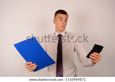 business man in a shirt with documents in hands on a white background emotions work office