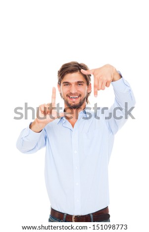 Man smile making frame picture with hand fingers, taking snapshot photograph camera, wear casual jeans blue shirt, isolated over white background