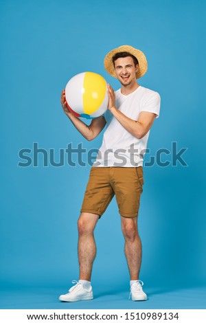 Cheerful man beach ball travel joy game