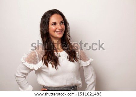 young business woman studio photo smiling and happy show something with copy space