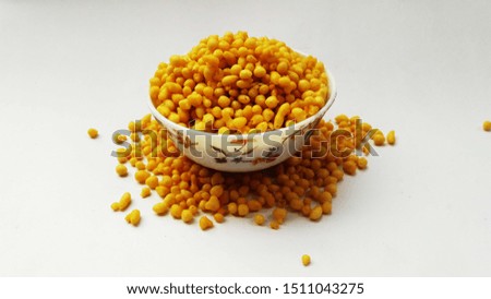 fresh and healthy deep fried gram flour balls in bowl isolated on white background