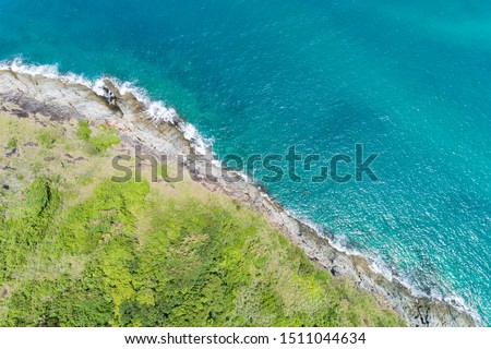 Aerial view of crashing waves on rocks landscape nature view and Beautiful tropical sea with Sea coast view in summer season image by Aerial view drone shot