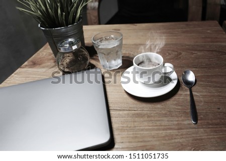 Laptop with Coffee Cup On The Wooden Table stock photo