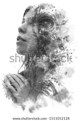 Paintography. Double exposure of woman's profile dissolving into swirls and shapes with floral motifs, black and white