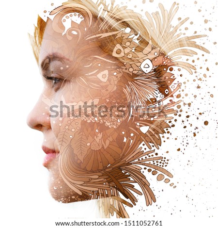 Paintography. Double exposure of woman's profile dissolving into golden swirls and shapes with floral motifs