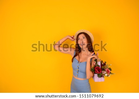woman in a blue dress holding flowers beautiful place free