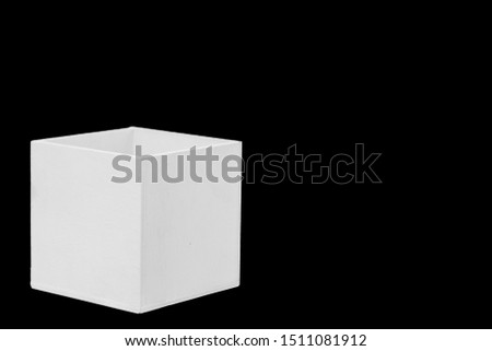 White wooden box on a black background