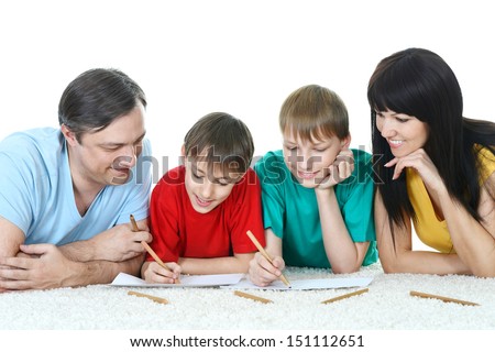 portrait of a happy family which draws picture