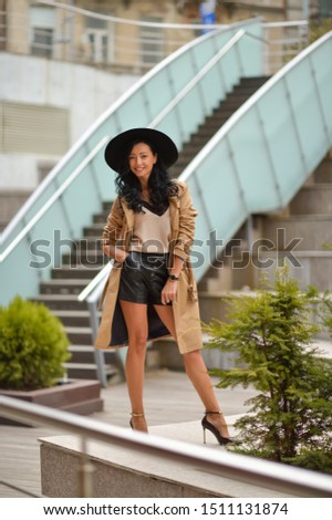 Beautiful brunette fashionable woman posing in Bucharest.
