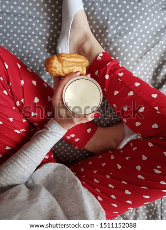 old socks, polka dot bed linen, milk, Eclair, glass, girl's hand, pastries