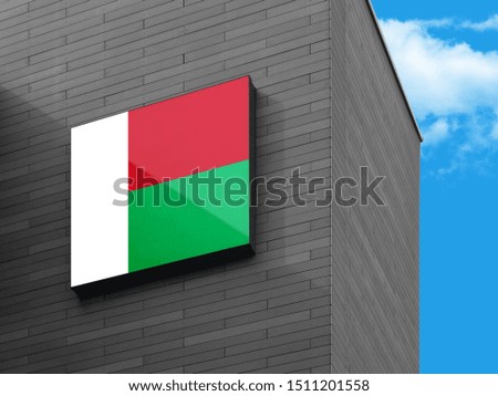 Flag of Madagascar on Signage Board. Madagascar Flag on building Signage Board.