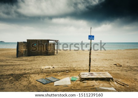 Empty beach with shop and signboard, Crete, Greece