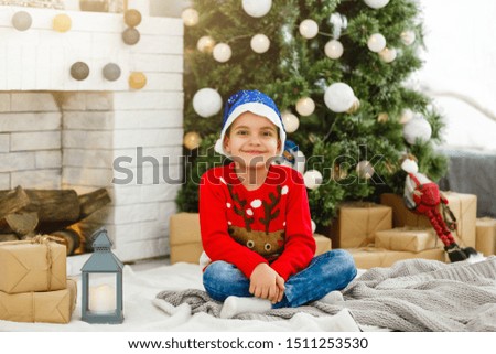 little boy near the christmas tree