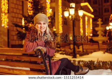 Night portrait of the girl in a winter city