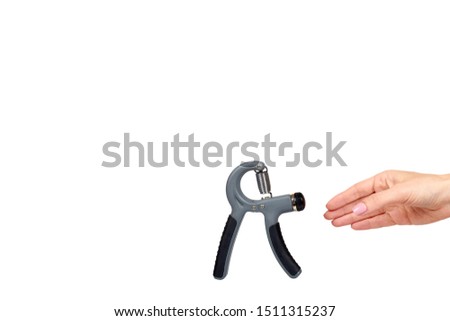 Hand with expander, sport equipment. Isolated on white background. Copy space template.