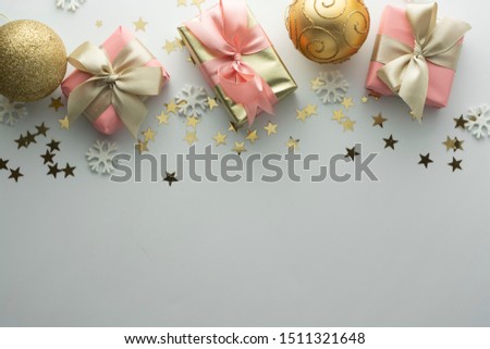 Christmas, baubles golden gift boxes party, birthday background. Celebrate shiny glitter copy space. Creative flat lay.