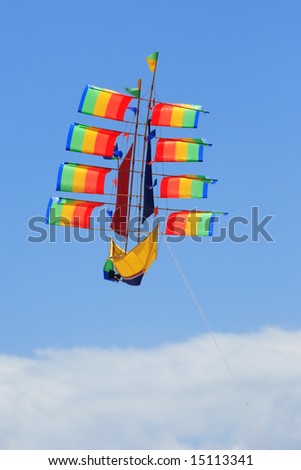 The flying ship on the blue sky background
