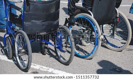 wheelchair wheels closeup on asphalt