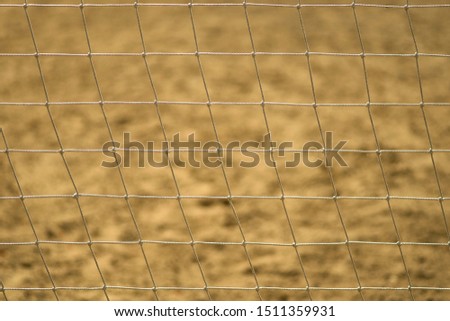 Football net close-up on the beach or Volleyball net on the street. Play outdoor