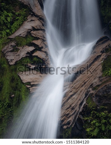 Flowing water over a waterfall in the forest