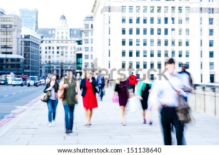 City commuters walking on the streets of London. High key blurry image of workers. Unrecognizable, bleached effect. Concept for Londoners, employment, migration, city lifestyles, modern life, future