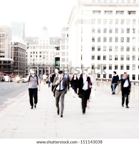 City Commuters. High key blurred image of workers walking in the city. Unrecognizable faces, bleached effect. Concept for Londoners, employment, migration, city lifestyles, modern life, future