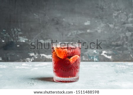Old-fashioned cocktail with figs on the rustic background. Selective focus. Shallow depth of field.