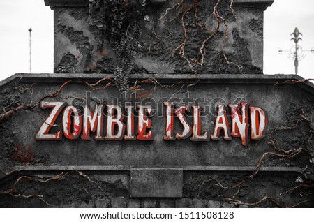 Zombie Island nameplate. Bloody sign on the wall. Halloween decoration