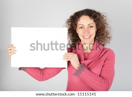 young woman keeps white sheet of paper