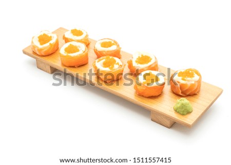 fresh salmon sushi roll with mayonnaise and shrimp egg isolated on white background