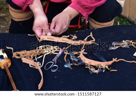 Picture of traditional indian work on leather during a north american festival to celebrate native americans. 