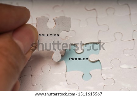 Problem solving or solution concept. Problem and solution wordings on puzzle pieces Royalty-Free Stock Photo #1511615567