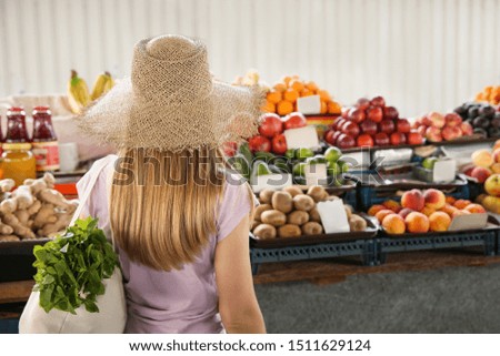 Woman choosing fruits at market
