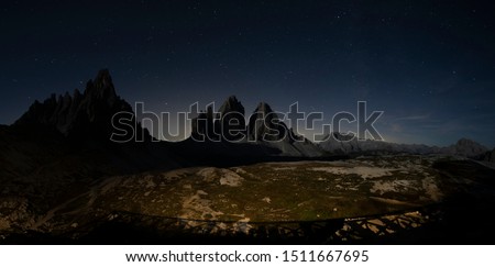 3 Peaks of Lavaredo in the panorama at night under the starry sky - Sesto Dolomites taken in 22Semptember 2019 in 3peaks of Lavaredo,Sesto Dolomites
