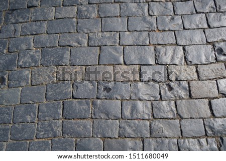 Square granite stones. Stone pavement texture. top view