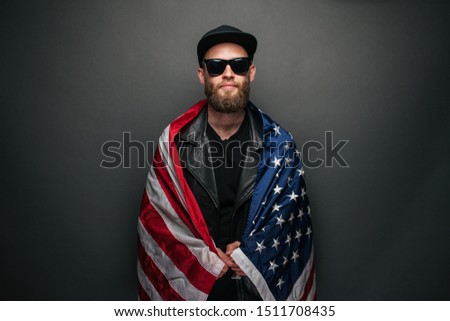 Patriot hipster man holding emotionally american USA flag