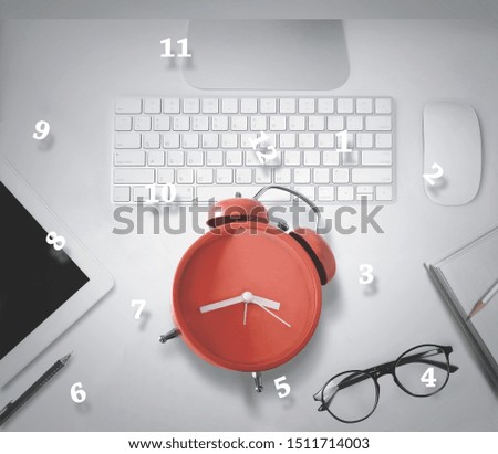 Red alarm clock on the desk with business competition concept